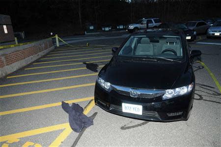 Clothing lays on the ground outside the car Adam Lanza drove to Sandy Hook Elementary School in Newtown, Connecticut, as pictured in this evidence photo released by the Connecticut State Police, December 27, 2013. REUTERS/Connecticut State Police/Handout