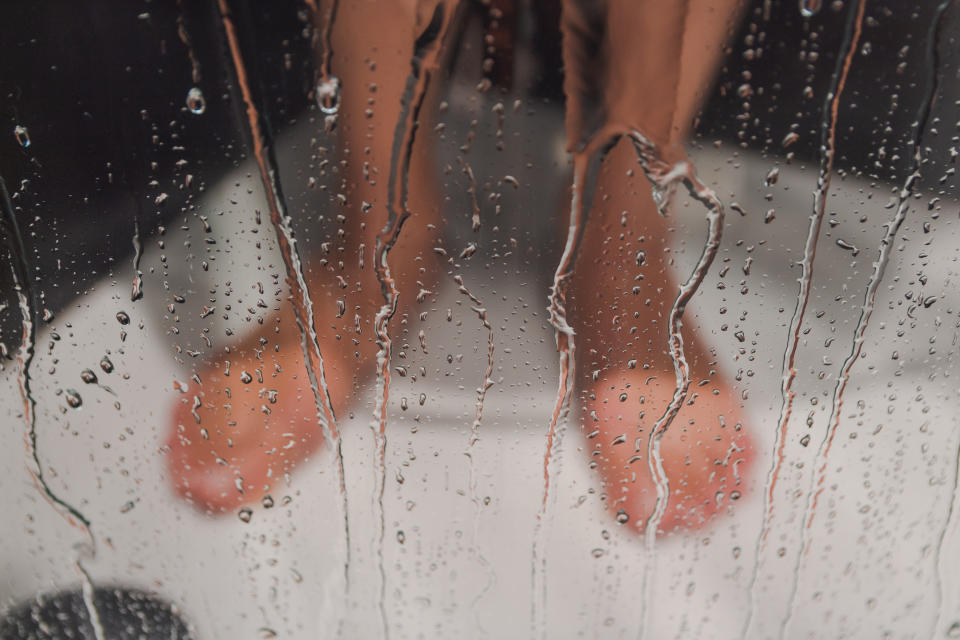 male taking a shower, picture of feets