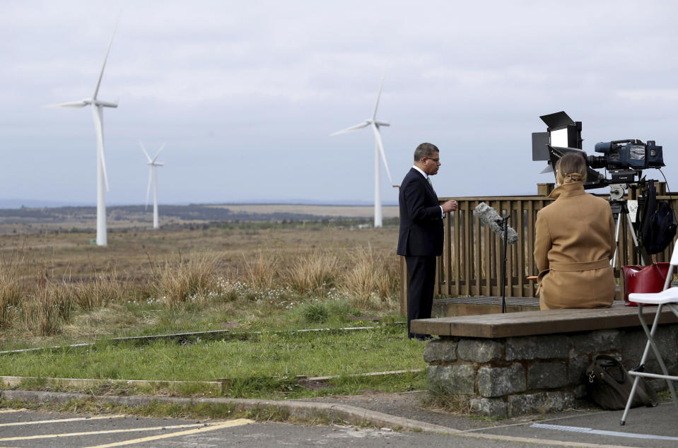 President of the 2021 United Nations Climate Change Conference, COP26, Alok Sharma rehearses a speech at Whitelee Windfarm in Glasgow, Scotland, Friday May 14, 2021. Sharma is setting out the importance of COP26 and the UK's ambitions over the next six months, running up to hosting the Nov. 1-12 summit, bringing world leaders together to face climate change issues. (Russell Cheyne/PA via AP)