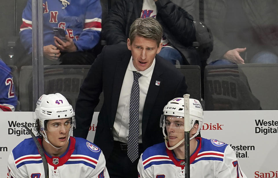 FILE - New York Rangers acting head coach Kris Knoblauch talks with players during the third period of his team's NHL hockey game against the New York Rangers in San Jose, Calif., Jan. 13, 2022. Jay Woodcroft is out as coach of the Edmonton Oilers after the supposed Stanley Cup contenders lost 10 of their first 13 games this season. Woodcroft was fired Sunday, Nov. 12, 2023. Knoblauch, Connor McDavid's junior hockey coach, was named Woodcroft's replacement, and Hall of Famer Paul Coffey joins his staff as an assistant. (AP Photo/Jeff Chiu, file)