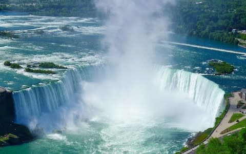 glimpse of the thunderous Niagara Falls - Credit: Getty