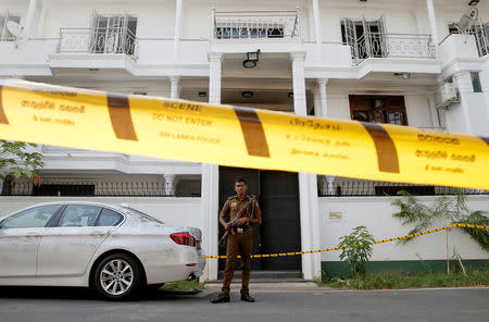 Police keep watch outside the family home of a bomber suspect where an explosion occurred during a Special Task Force raid, following a string of suicide attacks on churches and luxury hotels, in Colombo, Sri Lanka April 25, 2019. REUTERS/Thomas Peter