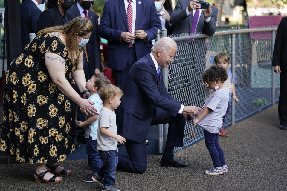 President Joe Biden greets children as he visits the Capitol Child Development Center, Friday, Oct. 15, 2021, in Hartford, Conn. (AP Photo/Evan Vucci)