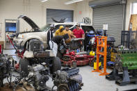 Students gather around a piece of equipment in the Hendry County Adult Automative Skills Lab on Thursday, March 14 ,2024. Student gain the necessary experience to receive certification and immediately enter the local workforce after completion in Clewiston, Fla. (AP Photo/Chris Tilley)