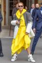 <p>Taking on streetwear, the singer stood out in a yellow raincoat-esque dress by Maison Margiela, an oversized blazer, and high-top sneakers. </p>