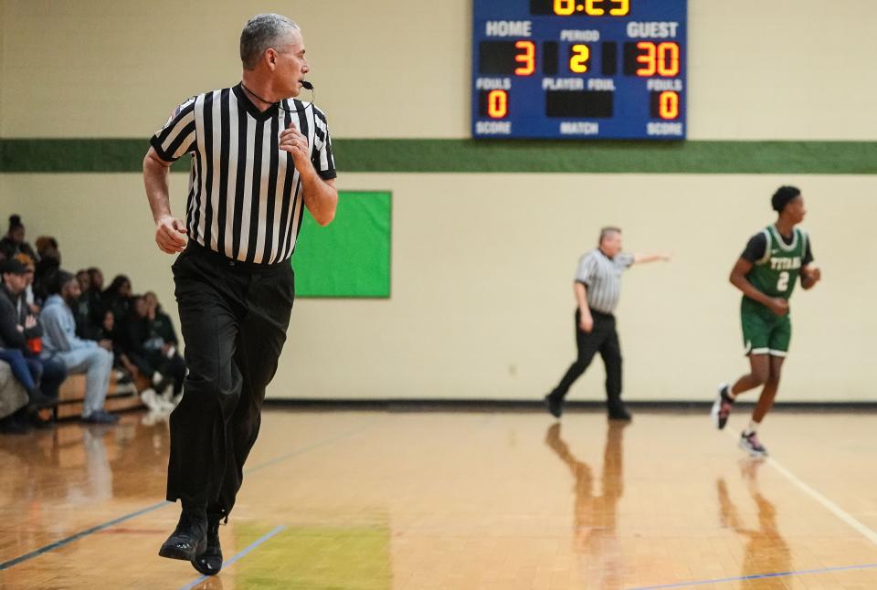 Casey Gaynor rushes up the court Tuesday, Jan. 2, 2024, during the game at Municipal Gardens in Indianapolis. Casey Gaynor, a high school basketball official, completed his journey to officiate a game at every high school in the state.