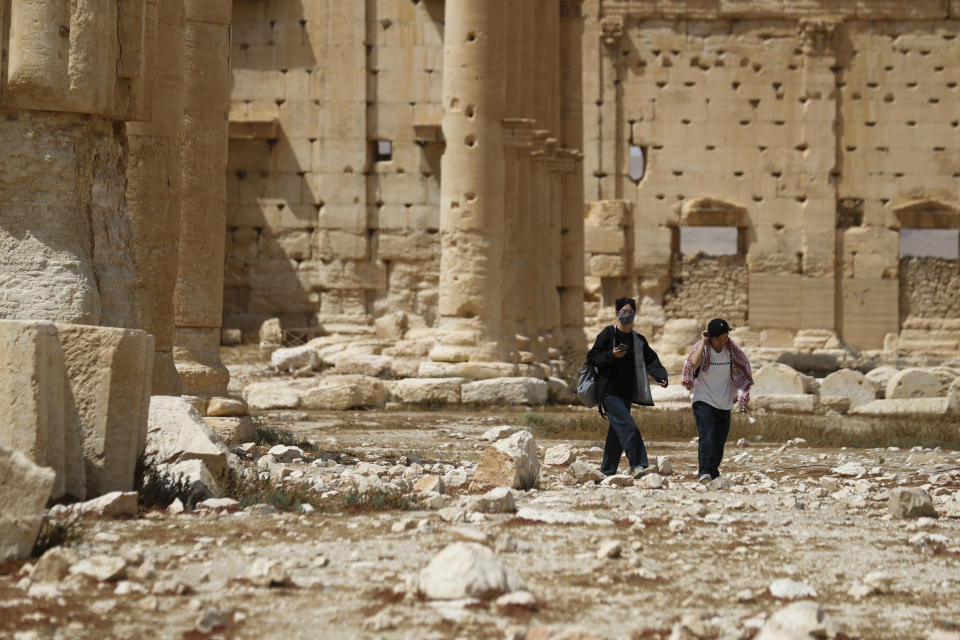 Tourists visit Roman ruins in Palmyra, Syria, Tuesday, May 11, 2023. Palmyra was captured by the Islamic Stae militants in 2015, who blew up some of the most iconic strictures. (AP Photo/Omar Sanadiki)