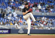 Miami Marlins pitcher Trevor Rogers winds up during the first inning of the team's baseball game against the Atlanta Braves, Friday, April 12, 2024, in Miami. (AP Photo/Michael Laughlin)