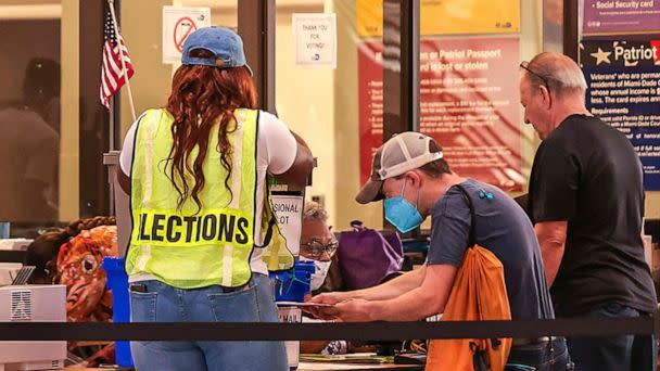 PHOTO: Miami-Dade residents cast their ballots during the first day of early voting in Miami-Dade County at the Miami-County Hall in downtown Miami, on Oct. 24, 2022. (Carl Juste/Miami Herald via AP)