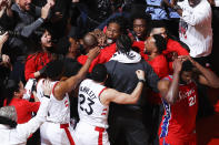 Kawhi Leonard #2 of the Toronto Raptors reacts to hitting the game winning shot against the Philadelphia 76ers during Game 7 of the Eastern Conference Semifinals of the 2019 NBA Playoffs on May 12, 2019 at the Scotiabank Arena in Toronto. (Photo by Mark Blinch/NBAE via Getty Images)