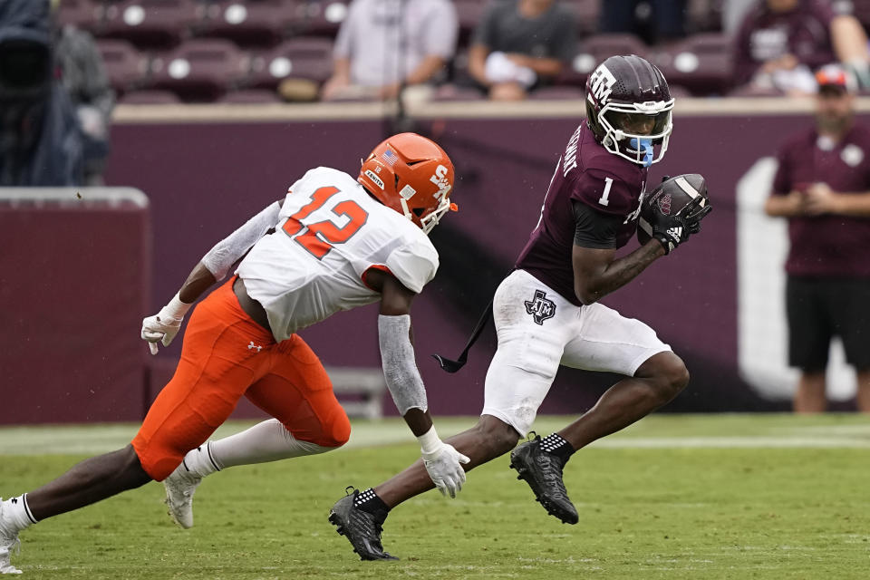 Texas A&M wide receiver Evan Stewart (1) catches a pass as Sam Houston State defensive back Donovan Adkins (12) defends during the second half of an NCAA college football game Saturday, Sept. 3, 2022, in College Station, Texas. (AP Photo/David J. Phillip)