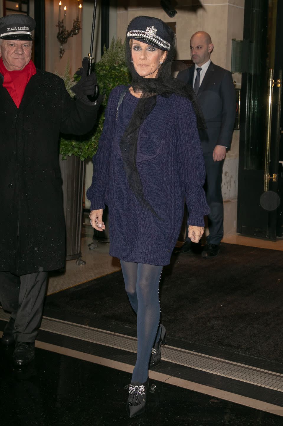 <p>Hello, 911? Dion slayed yet again while out in Paris. This time, she donned an embellished newsboy cap and navy blue sweater dress look. </p>