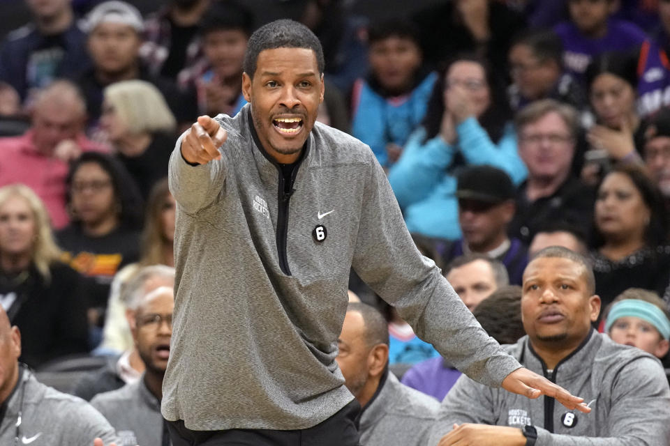 Houston Rockets head coach Stephen Silas reacts to a call during the first half of the team's NBA basketball game against the Phoenix Suns, Friday, Dec. 2, 2022, in Phoenix. (AP Photo/Rick Scuteri)