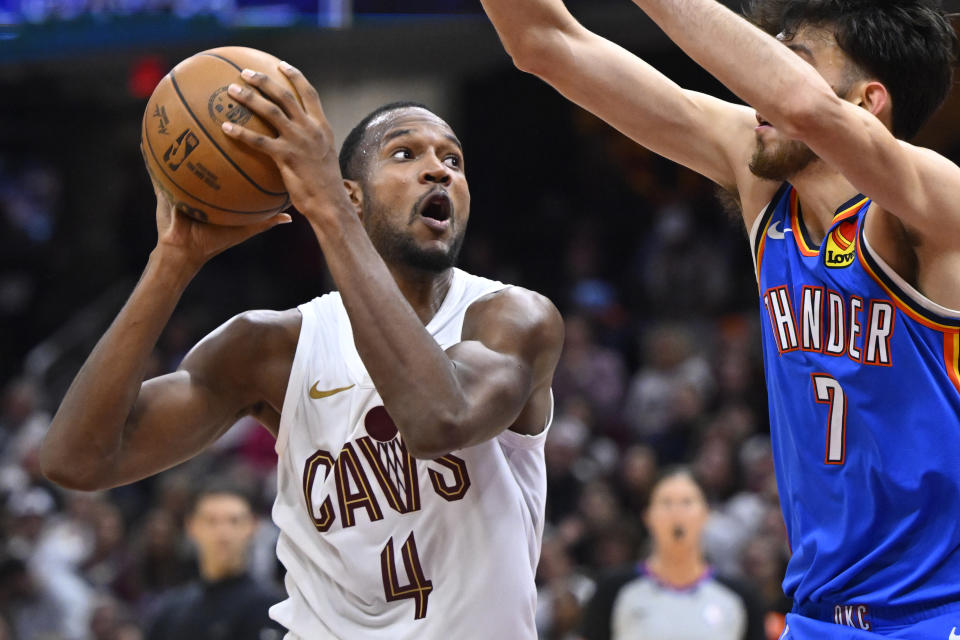 Oct 27, 2023; Cleveland, Ohio, USA; Cleveland Cavaliers forward Evan Mobley (4) looks to shoot beside Oklahoma City Thunder forward Chet Holmgren (7) in the third quarter at Rocket Mortgage FieldHouse. Mandatory Credit: David Richard-USA TODAY Sports