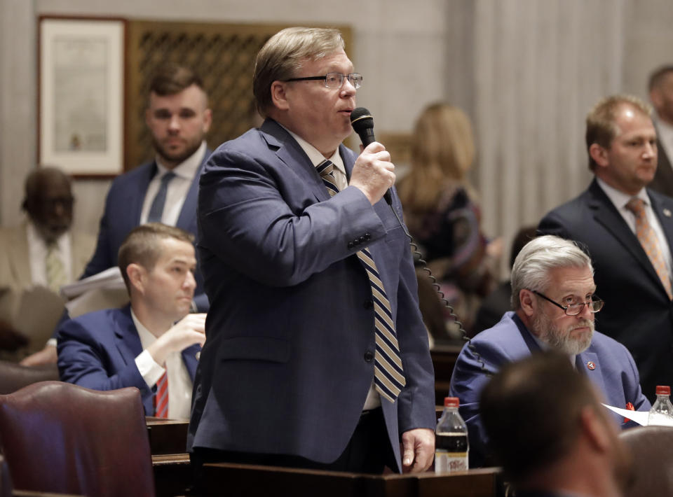 FILE - In this April 15, 2019 file photo, Rep. Tim Rudd, R-Murfreesboro, speaks during a House session in Nashville, Tenn. Rudd, the sponsor of Tennessee’s new law requiring businesses and government facilities to post signs if they let transgender people access their preferred, multi-person public bathrooms now says those who refuse could face up to six months in jail. Rudd said this week that the misdemeanor penalty could apply. (AP Photo/Mark Humphrey, File)