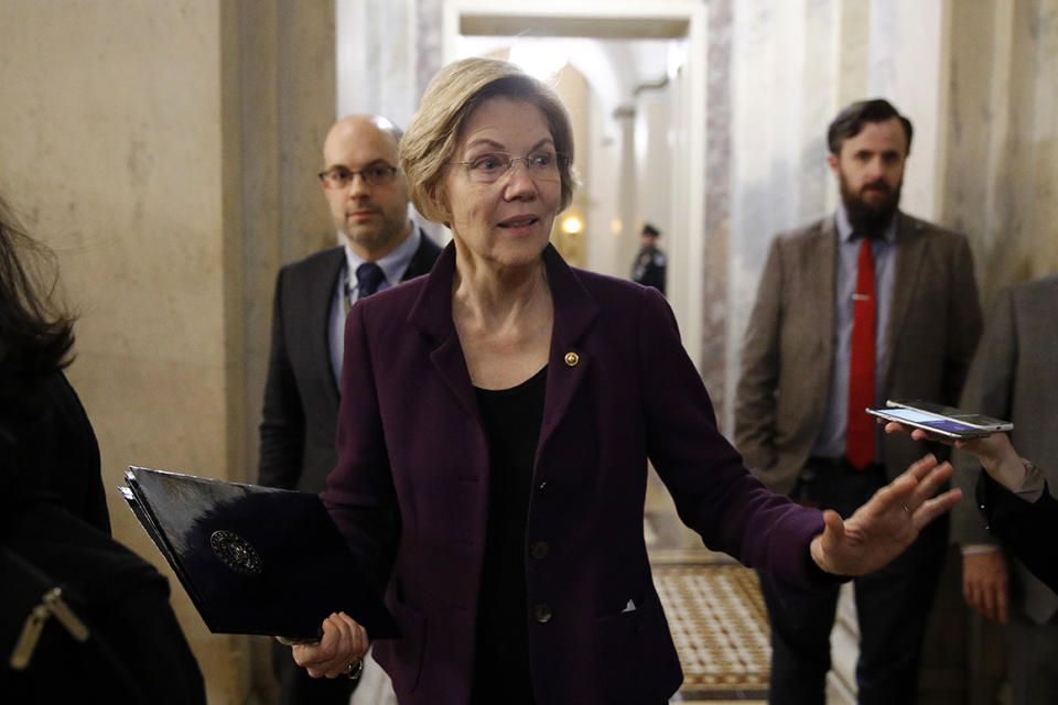 Sen. Elizabeth Warren, D-Mass., speaks with reporters as she departs at the end of the day in the impeachment trial of President Donald Trump on charges of abuse of power and obstruction of Congress on Capitol Hill in Washington, Wednesday, Jan. 29, 2020. (AP Photo/Patrick Semansky)