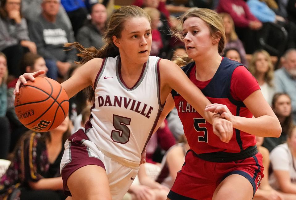Danville's Maddy Wethington (5) rushes up the court against Plainfield Quakers guard Morgan Barnes (5) on Saturday, Jan. 6, 2024, during the game at Danville Community High School in Danville.