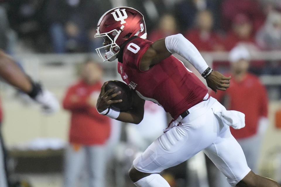 Indiana quarterback Donaven McCulley (0) runs with the ball while playing Ohio State during the first quarter of an NCAA college football game in Bloomington, Ind., Saturday, Oct. 23, 2021. (AP Photo/AJ Mast)
