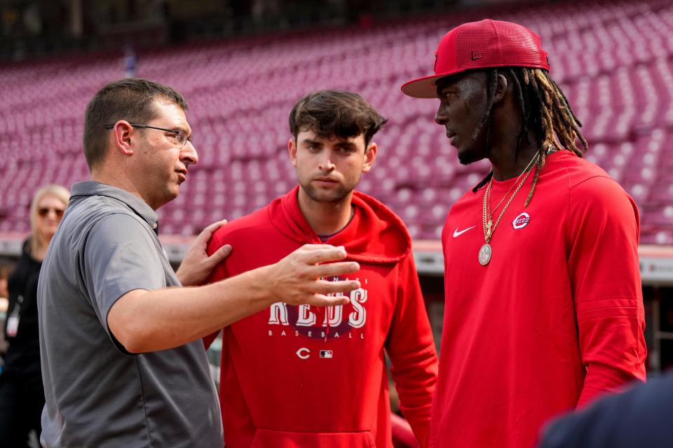 Cincinnati Reds general manager Nick Krall talks with third baseman Elly De La Cruz (44) during batting practice before the MLB National League game between the Cincinnati Reds and the LA Dodgers at Great American Ball Park in downtown Cincinnati on Tuesday, June 6, 2023.