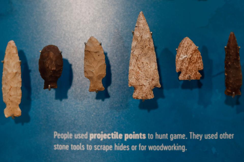 Arrowheads and projectile points sit on display at the new exhibit at Jester Park Nature Center in Granger on Tuesday, Nov. 29, 2022. The new exhibit honors the archaeological history of Iowa and the presence of Native Americans on Polk County land.