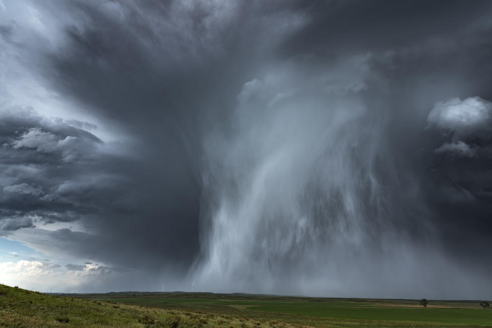 Extreme hail storm falling on the high plains of Nebraska. This extreme weather event caused damage to vehicles and property, Nebraska, USA.