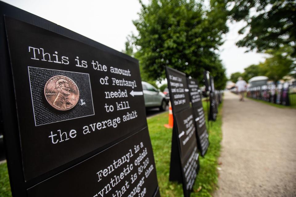 A poster showing the amount of fentanyl that is lethal to humans on display at the Black Poster Project at Crane Park in Monroe, Aug. 7, 2021.