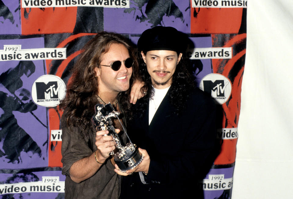 Metallica's Lars Ulrich and Kirk Hammett celebrate after winning the 'Best Metal/Hard Rock Video' at the MTV Video Music Awards ceremony in Los Angeles