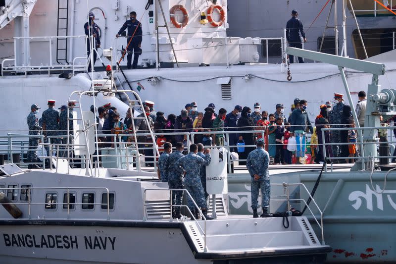 Rohingyas board a ship as they are moved to Bhasan Char island in Chattogram,