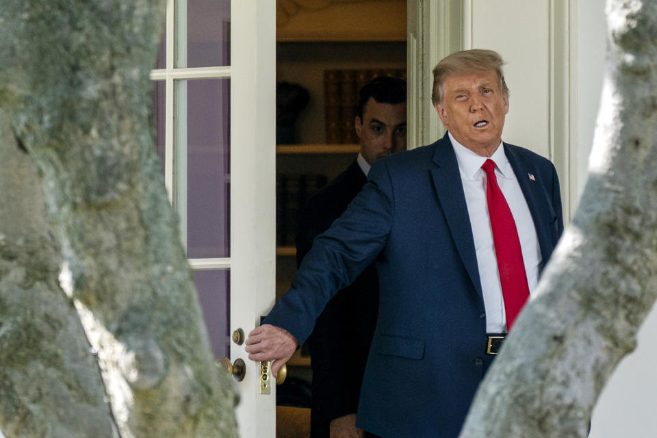 President Donald Trump walks from the Oval Office before boarding Marine One at the White House, Wednesday, Sept. 30, 2020, in Washington, for the short trip to Andrews Air Force Base en route to Minnesota. (AP Photo/Carolyn Kaster)