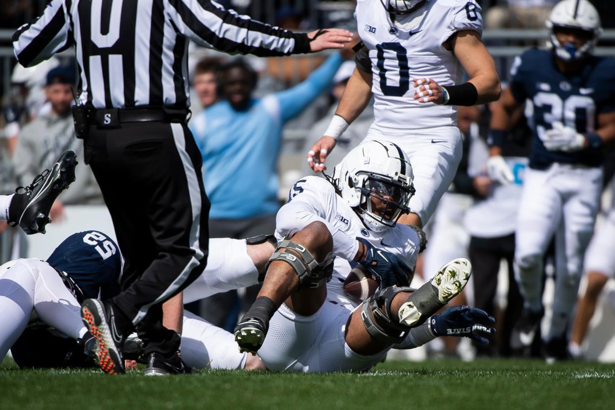 Penn State defensive end Amin Vanover comes down with an interception during the Blue-White game at Beaver Stadium on Saturday, April 13, 2024, in State College. The White team defeated the Blue team, 27-0.