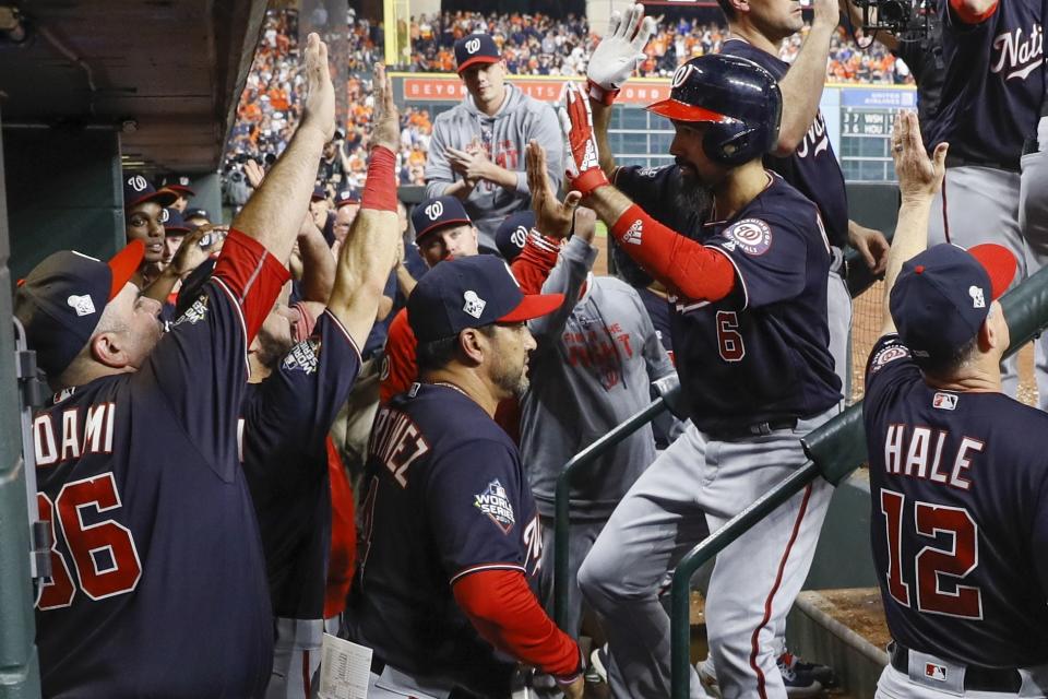 Washington Nationals' Anthony Rendon is congratulated after hitting a two-run home run during the seventh inning of Game 6 of the baseball World Series against the Houston Astros Tuesday, Oct. 29, 2019, in Houston. (AP Photo/Matt Slocum)