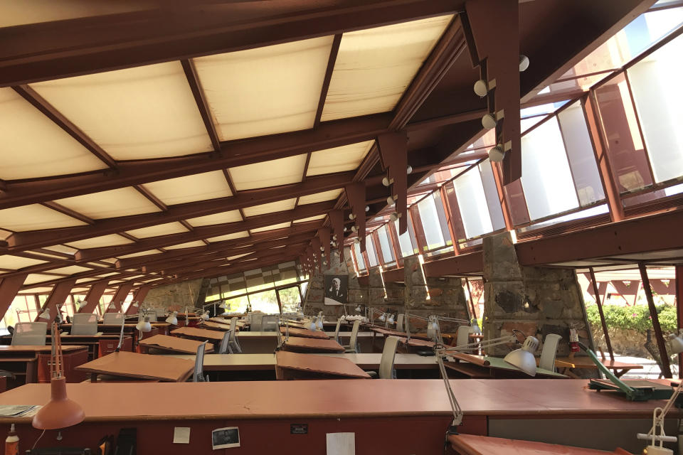 File - This Sept. 24, 2017, file photo, shows the drafting room at Taliesin West in Scottsdale, Ariz., the winter home of architect Frank Lloyd Wright and the architecture school he founded. The architecture school that architect Frank Lloyd Wright started nearly 90 years ago is closing. School officials announced Tuesday, Jan. 28, 2020, that the School of Architecture at Taliesin, which encompasses Wright properties in Wisconsin and Arizona, will shutter in June. (AP Photo/Anita Snow, File)