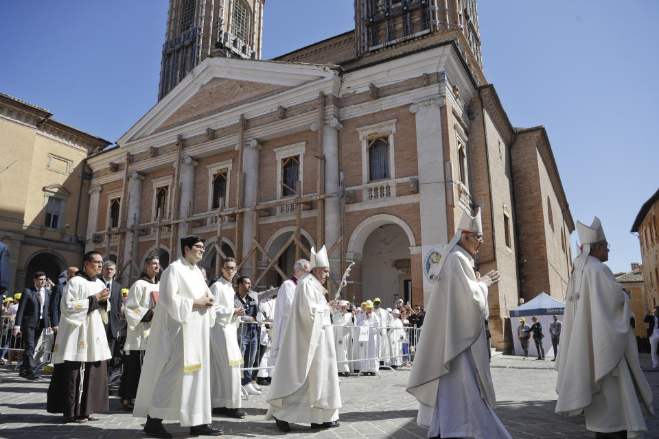 Pope Francis walks in procession in front of the Cathedral of Camerino, Italy, as he arrives to celebrate mass, Sunday, June 16, 2019. The town of Camerino was heavily damaged by the 2016 earthquake that hit the central Italian Marche region. (AP Photo/Gregorio Borgia)