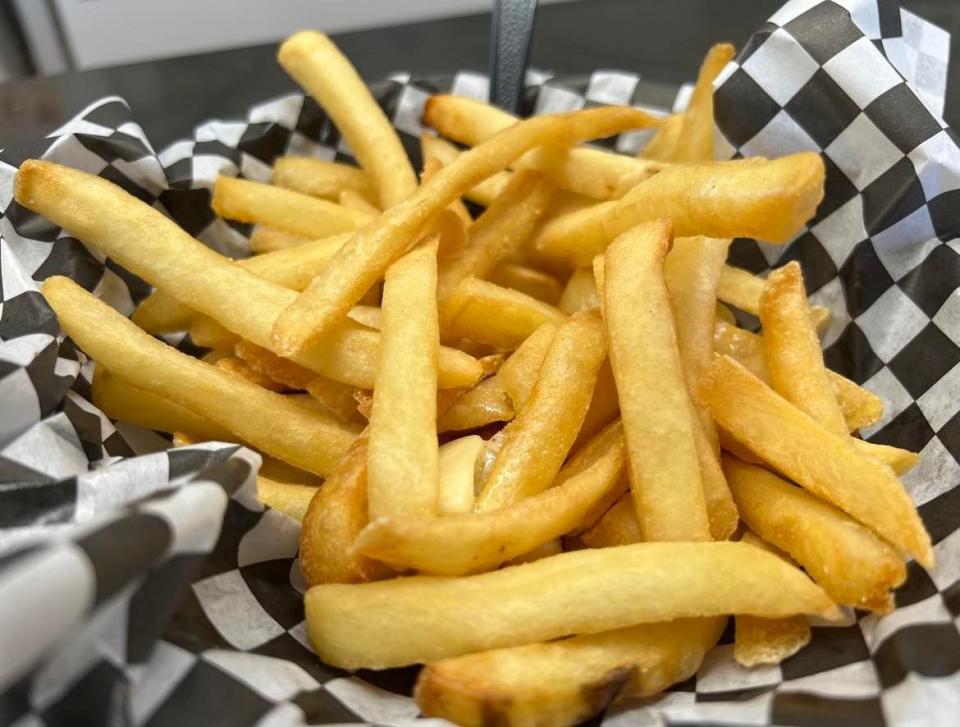 Heggy's fries are served with the restaurant's signature pat of butter (or multiple pats). Butter melts and can be smeared over the hot fries.