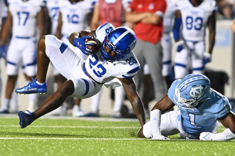 Sep 11, 2021; Chapel Hill, North Carolina, USA; Georgia State Panthers running back Marcus Carroll (23) is tackled by North Carolina Tar Heels defensive back Kyler McMichael (1) n the second quarter at Kenan Memorial Stadium.