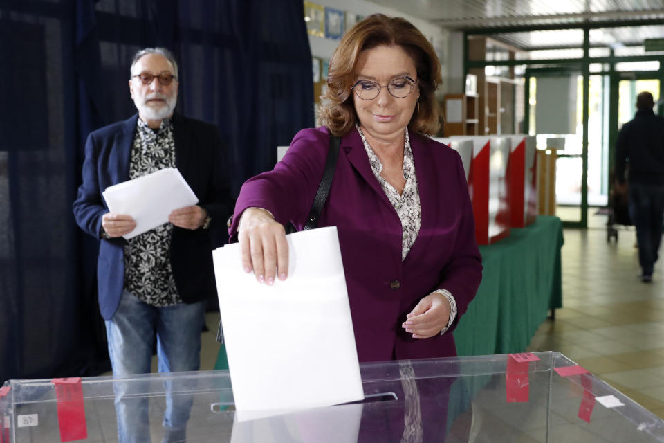 Opposition leader Malgorzata Kidawa-Blonska casts her ballot at a polling station in Warsaw, Poland, Sunday, Oct. 13, 2019. Poles are voting Sunday in a parliamentary election that the ruling party of Jaroslaw Kaczynski is favored to win easily, buoyed by the popularity of its social conservatism and generous social spending policies that have reduced poverty. (AP Photo/Darko Bandic)