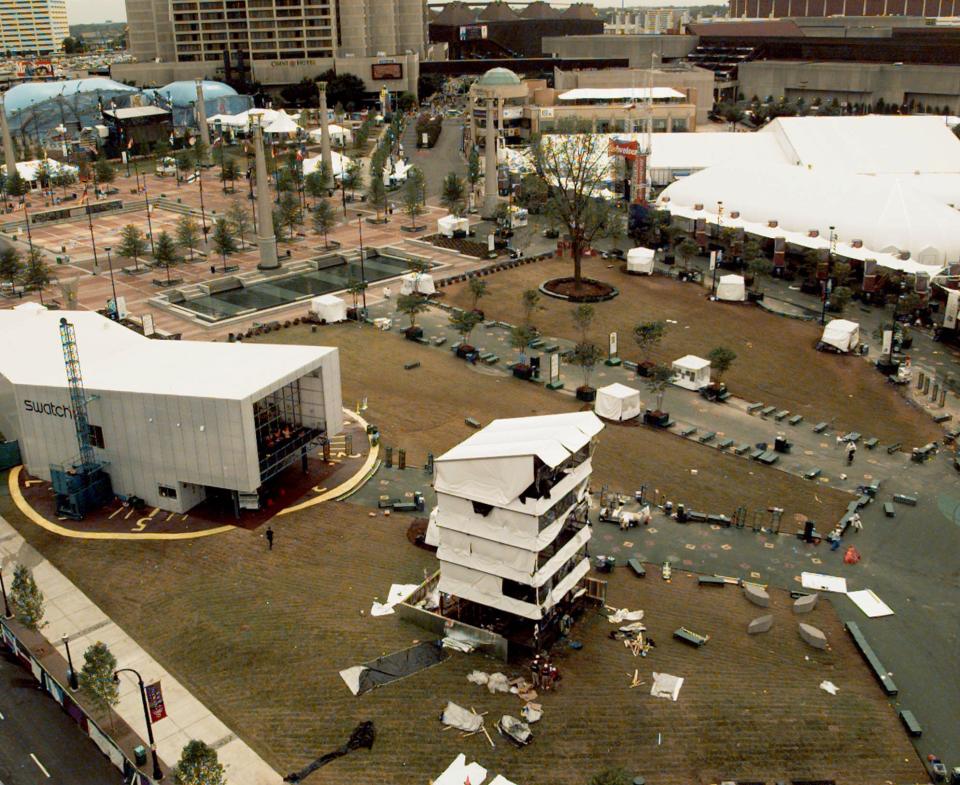 FILE - This Sunday, July 28, 1996, file photo shows Centennial Park at the 1996 Olympic Games in Atlanta, the day after an explosion centered at the bottom of the temporary tower, in the foreground. (AP Photo/John Gaps III, File)