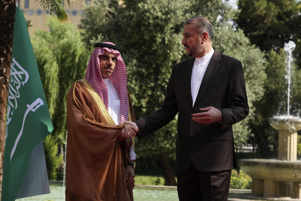Iranian Foreign Minister Hossein Amirabdollahian, right, and his Saudi counterpart Prince Faisal bin Farhan shake hands prior to their meeting in Tehran, Iran, Saturday, June 17, 2023. Saudi Arabia’s top diplomat has arrived in the Iranian capital,Tehran, the latest step in the restoration of diplomatic ties between the two Mideast rivals, Iranian state media reported. (AP Photo/Vahid Salemi)