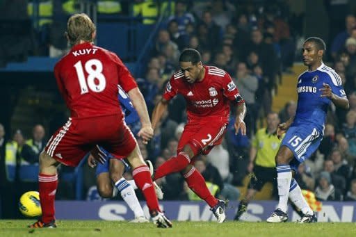 Liverpool's Glen Johnson (C) scores a goal against Chelsea during an English Premier League football match at Stamford Bridge in London. Johnson's 87th minute goal secured Liverpool's 2-1 win