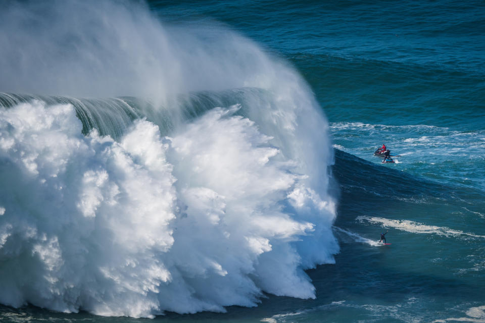 NAZARE, PORTUGAL - 2020/10/29: Big wave surfer Justine Dupont from France rides a wave during a tow surfing session at Praia do Norte on the first big swell of winter season. (Photo by Henrique Casinhas/SOPA Images/LightRocket via Getty Images)