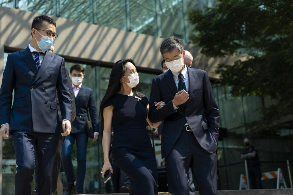 Meng Wanzhou, chief financial officer of Huawei, leaves for a lunch break during her extradition hearing at British Columbia Supreme Court Friday, Aug. 13, 2021 in Vancouver, British Columbia. (Jimmy Jeong/The Canadian Press via AP)