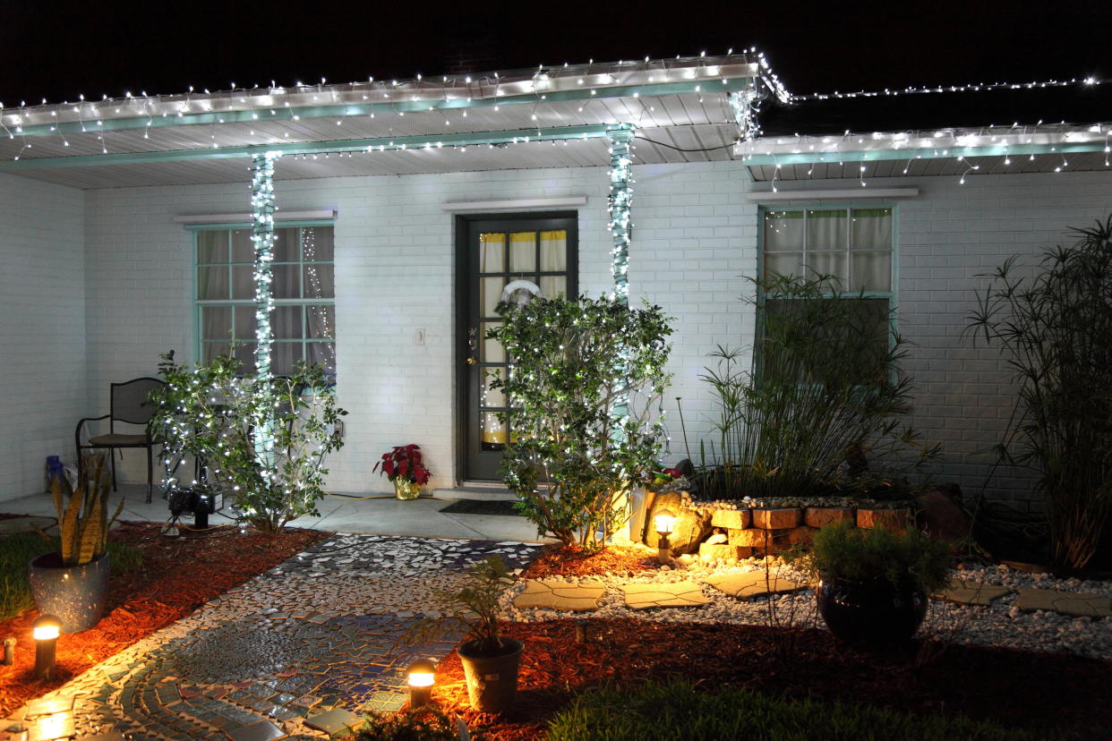  A front yard decorated with Christmas lights. 