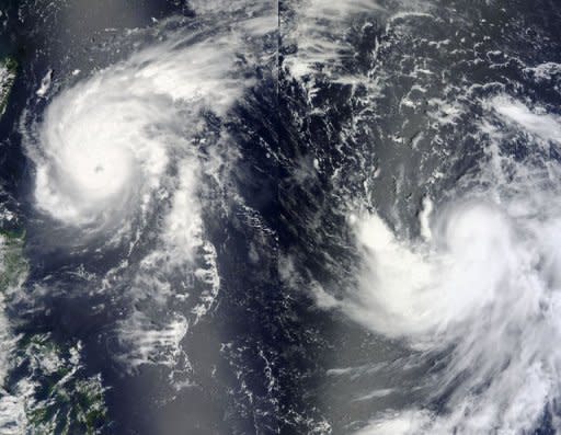 A NASA satellite image shows Typhoon Tembin (L) and Tropical Storm Bolaven (R) on August 21 in the Philippine Sea. South Korea was Monday bracing for major typhoon Bolaven, with a main port and ferry routes closed, classes cancelled, a military exercise suspended and officials put on high alert