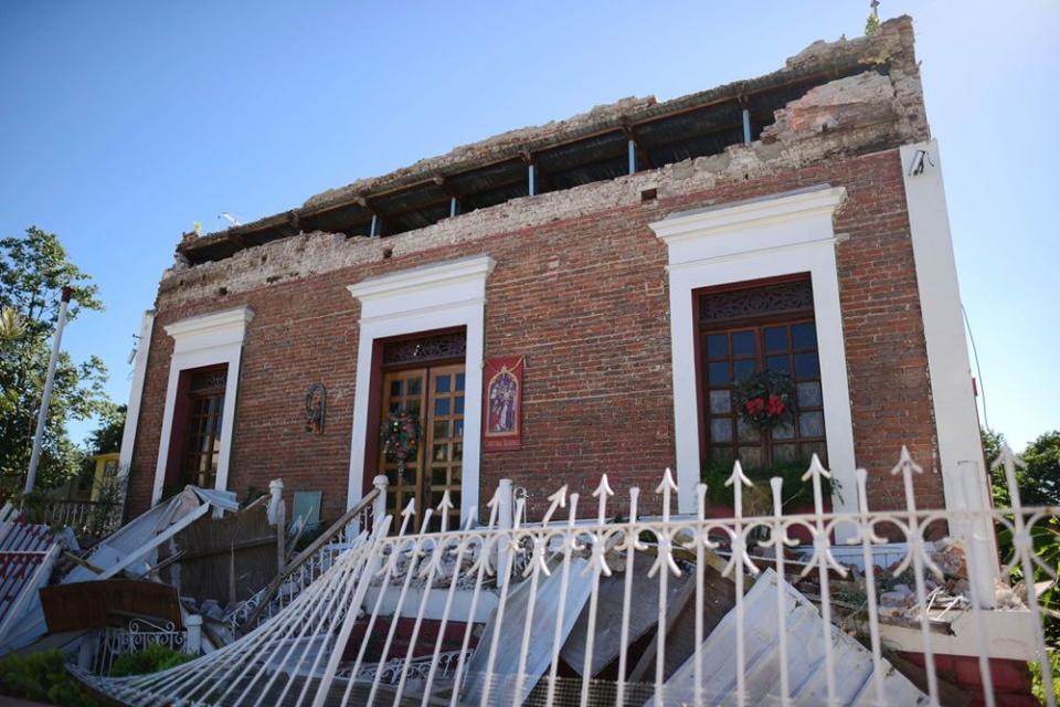 A partially collapsed building in Guayanilla, Puerto Rico | Carlos Giusti/AP/Shutterstock