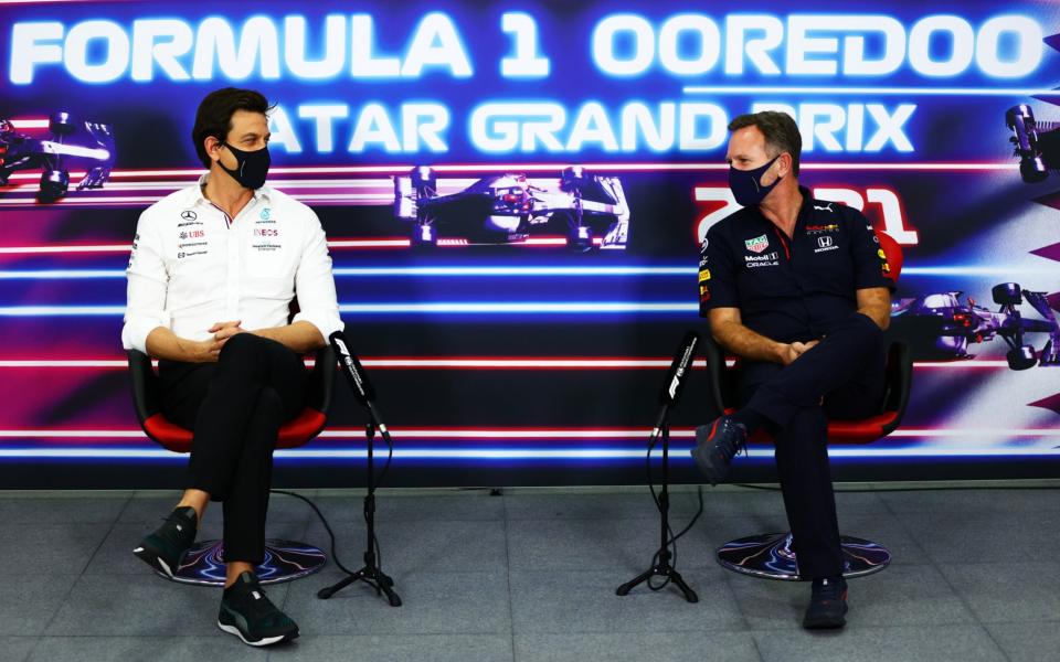 Mercedes GP Executive Director Toto Wolff and Red Bull Racing Team Principal Christian Horner talk in the Team Principals Press Conference during practice ahead of the F1 Grand Prix of Qatar at Losail International Circuit on November 19, 2021 in Doha, Qatar.  - Dan Istitene/Getty Images Europe