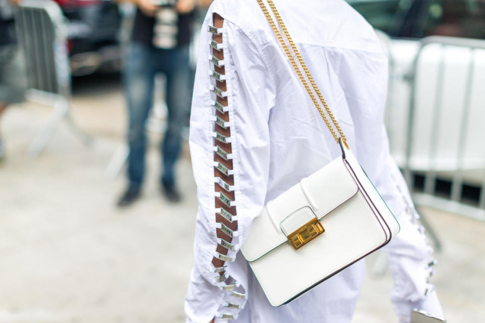 A white leather Lanvin shoulder purse is perfectly elegant at New York Fashion Week.