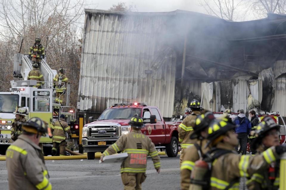 Firefighters at the scene of the factory fire in New Windsor (AP)