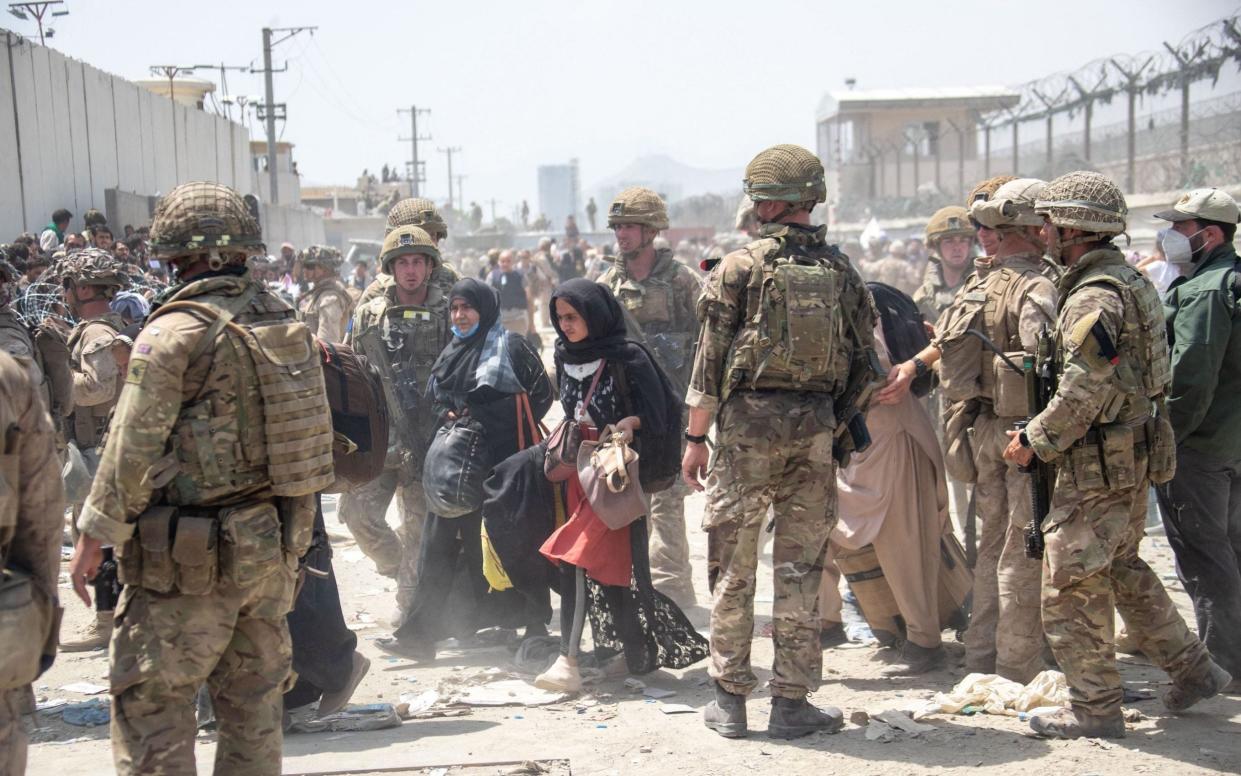 Members of the British and US Armed Forces working at Kabul Airport - Ministry of Defence/AFP via Getty Images