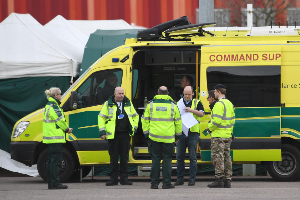 Ambulance crews and military personnel await the first patients at the ExCel centre in London which is being made into the temporary NHS Nightingale hospital to help tackle coronavirus. (Photo by Stefan Rousseau/PA Images via Getty Images)