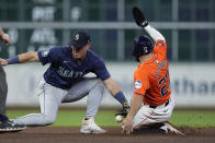 Seattle Mariners shortstop Dylan Moore misses the tag as Houston Astros' Jose Altuve steals second base during the seventh inning of a baseball game Friday, May 3, 2024, in Houston. The play was Altuve's 300th career steal. (AP Photo/Kevin M. Cox)